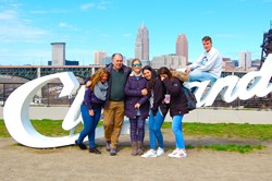 Spanish students pose on Cleveland sculpture.