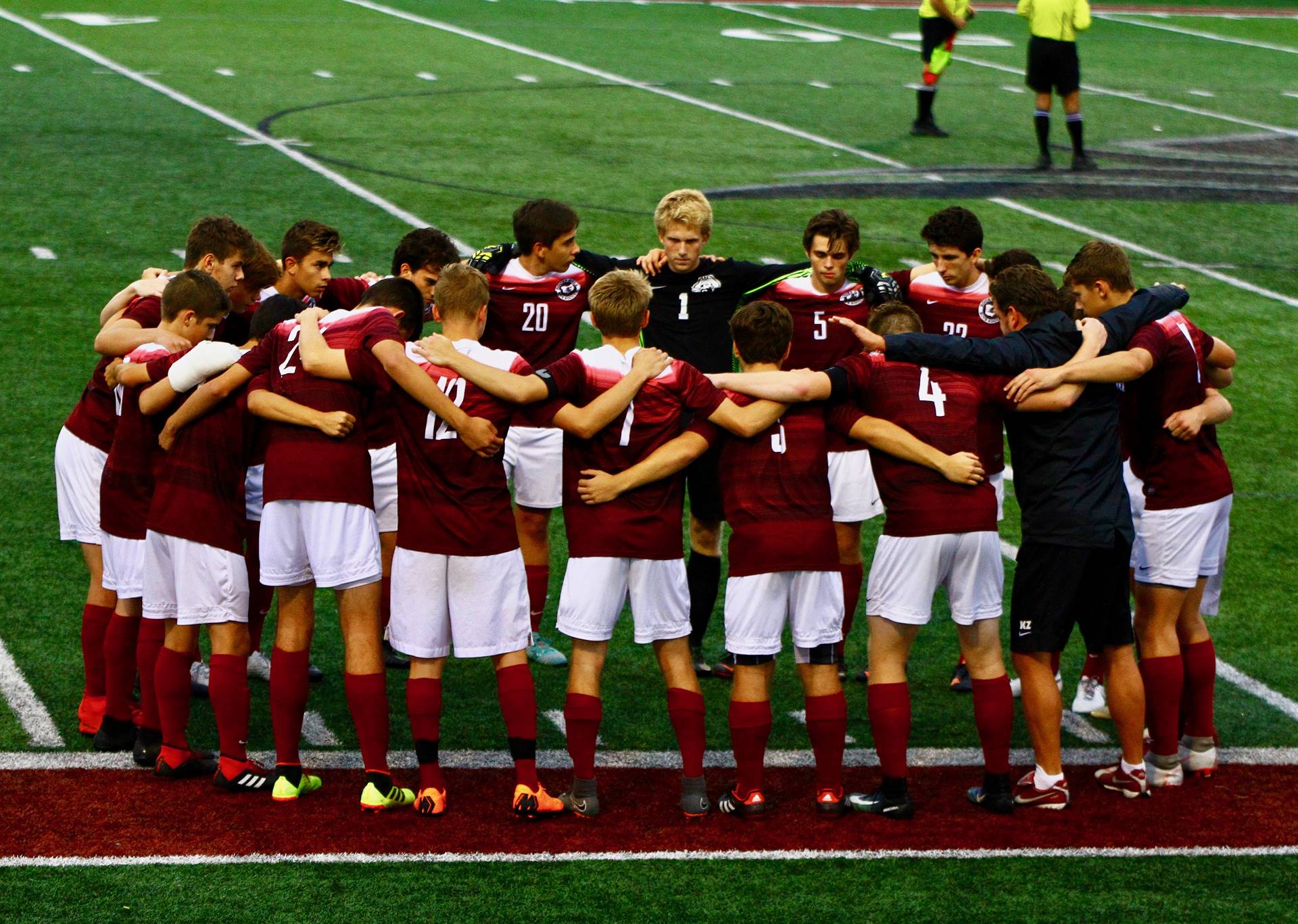 2018 Varsity team huddle before the Lutheran West game