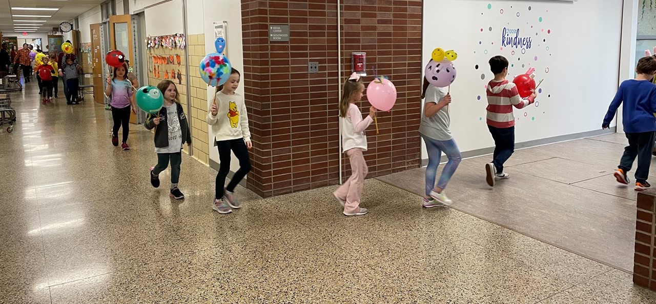 Second Grade students have a Thanksgiving Balloon Parade through the halls at Goldwood Primary