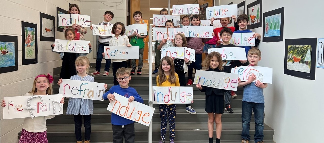 Students display their projects created with the words of the week