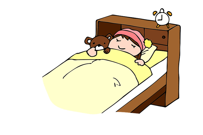 Child in bed sleeping with a teddy bear and alarm clock